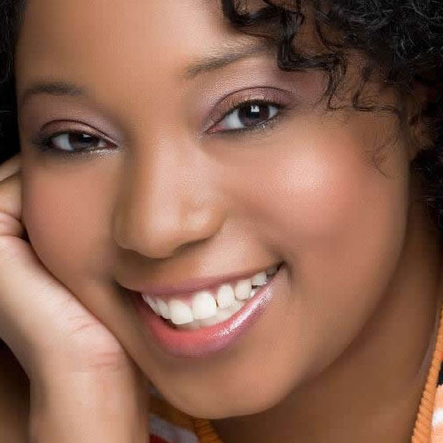 Clean white teeth on smiling ebony woman